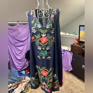 Umgee brand dress.  Sleeveless navy with embroidered floral design.Pockets.small
